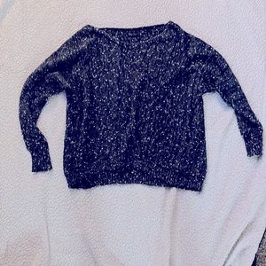 Green and white speckled sweater